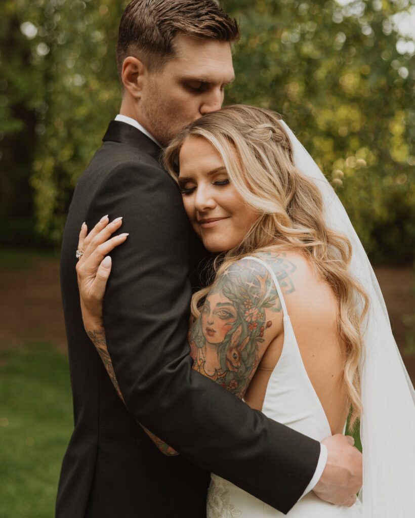 Bride and groom hugging