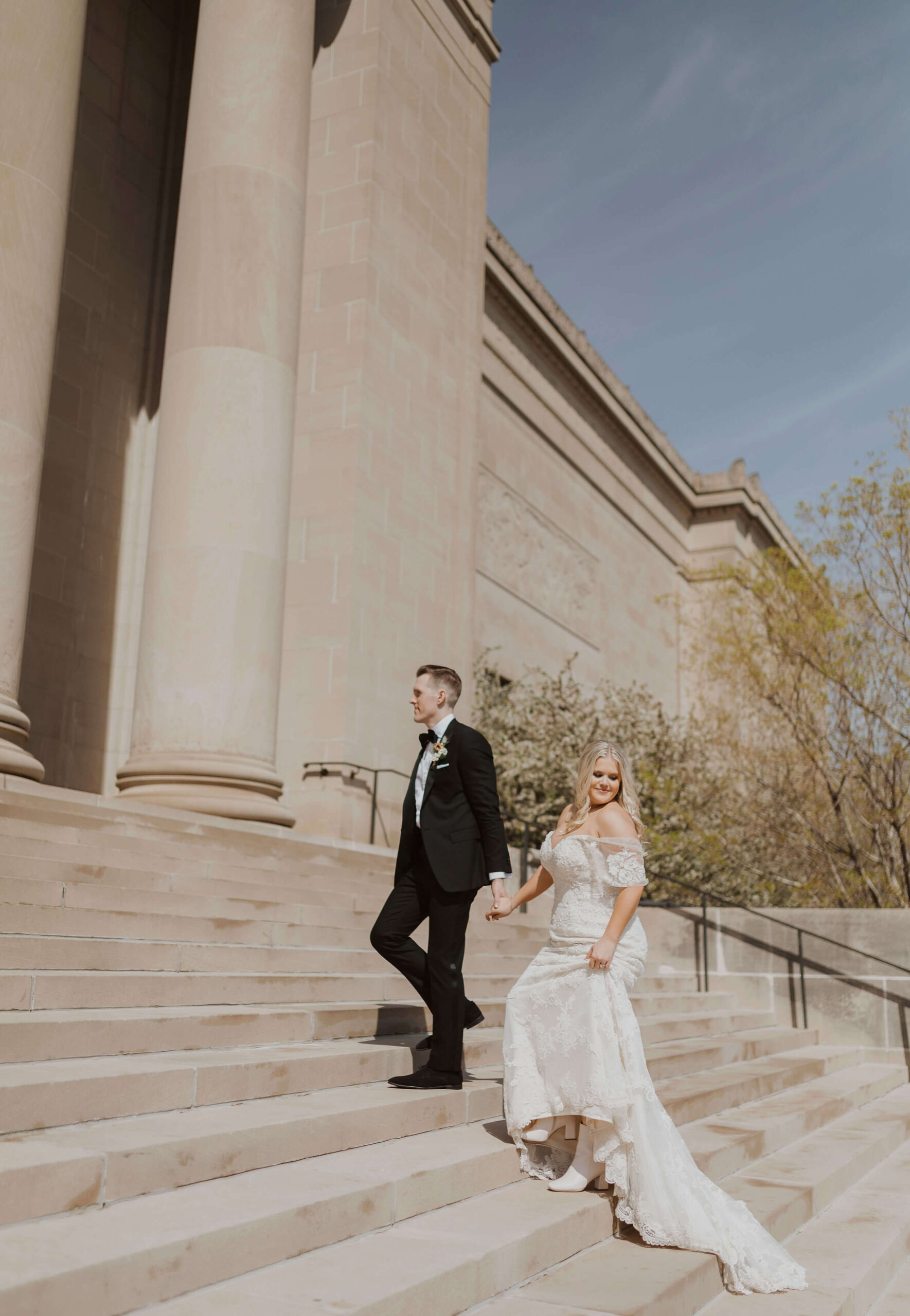 Bride and groom posing on steps for Kansas City elopement