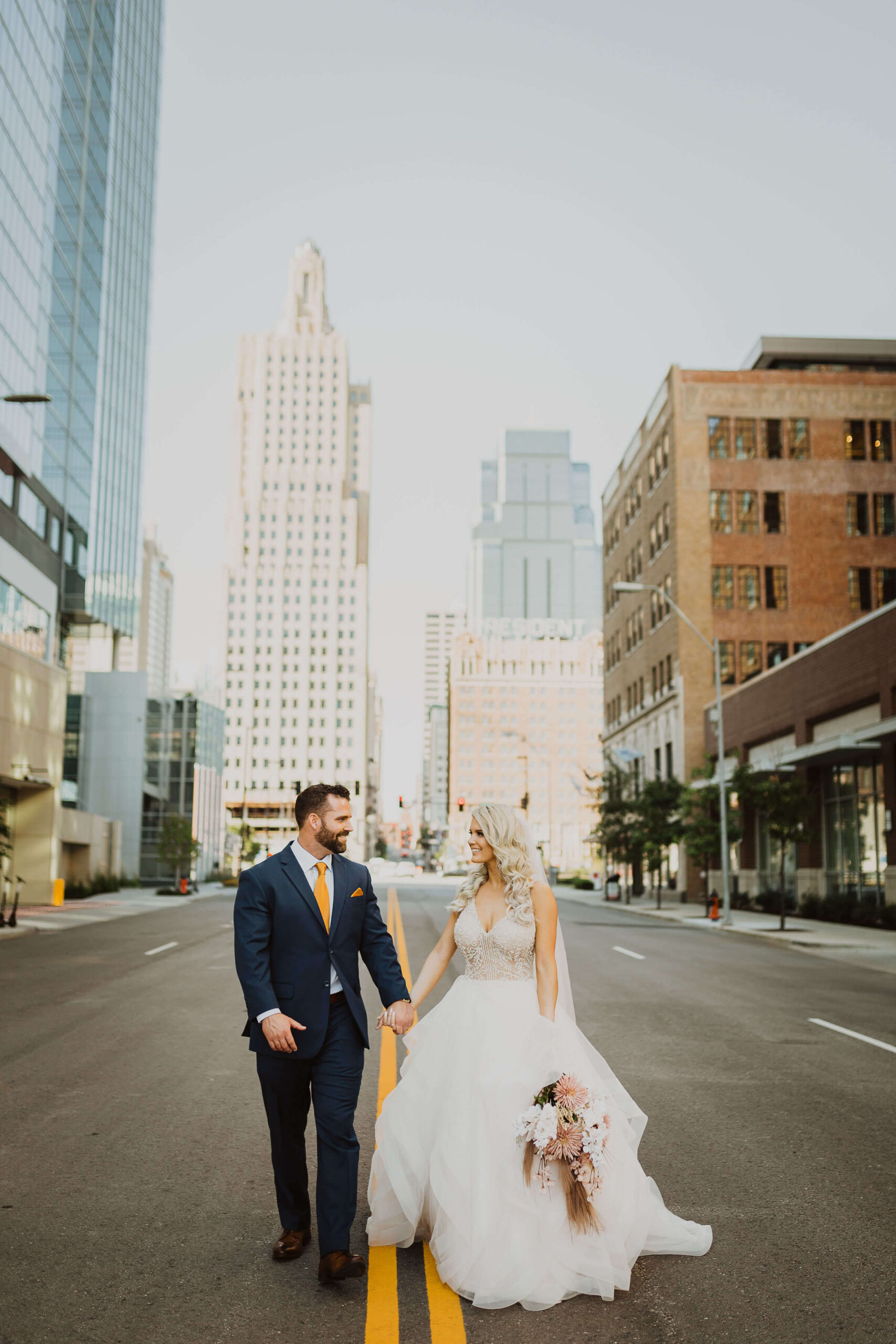 Bride and groom posing in downtown Kansas City