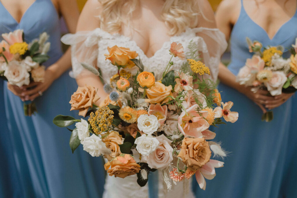 Bride and bridesmaids holding flowers