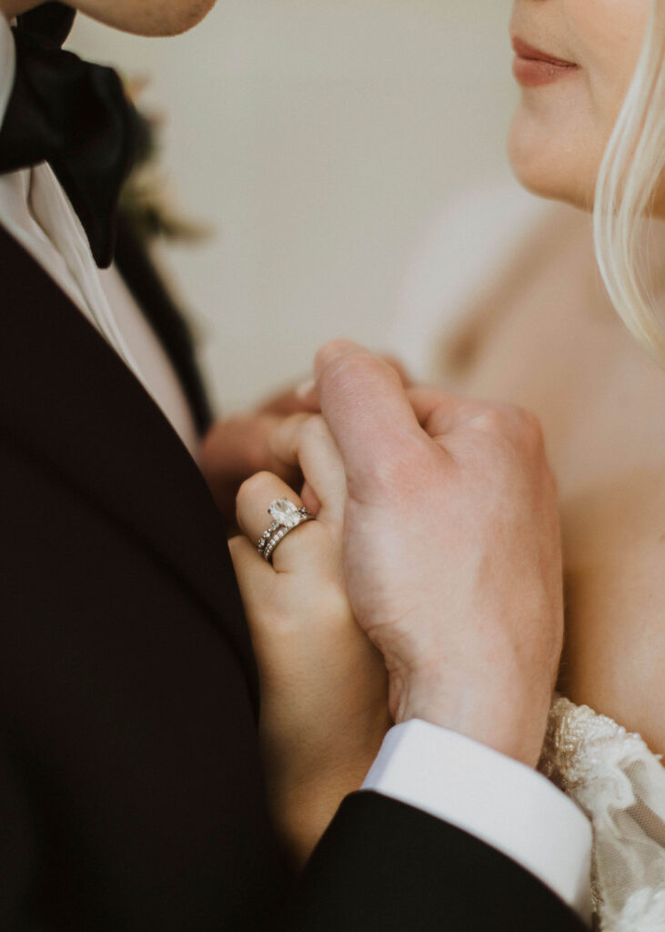 Bride and groom holding hands