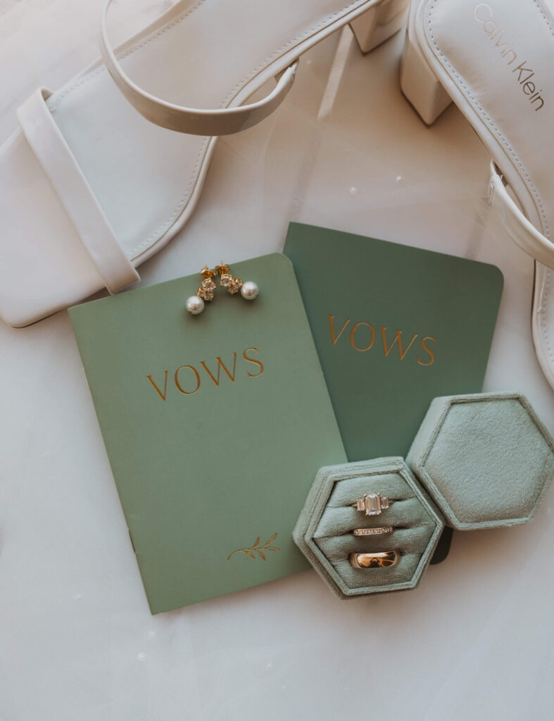 wedding shoes, vow books, and rings