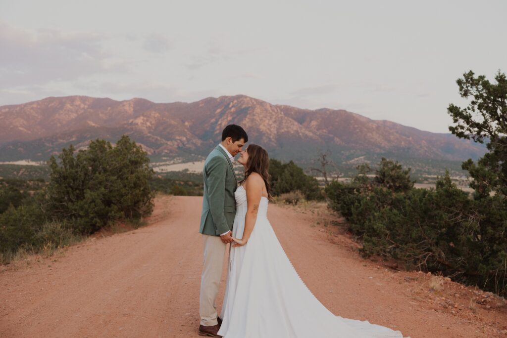 Bride and groom posing outside for wedding photos in Steamboat Springs