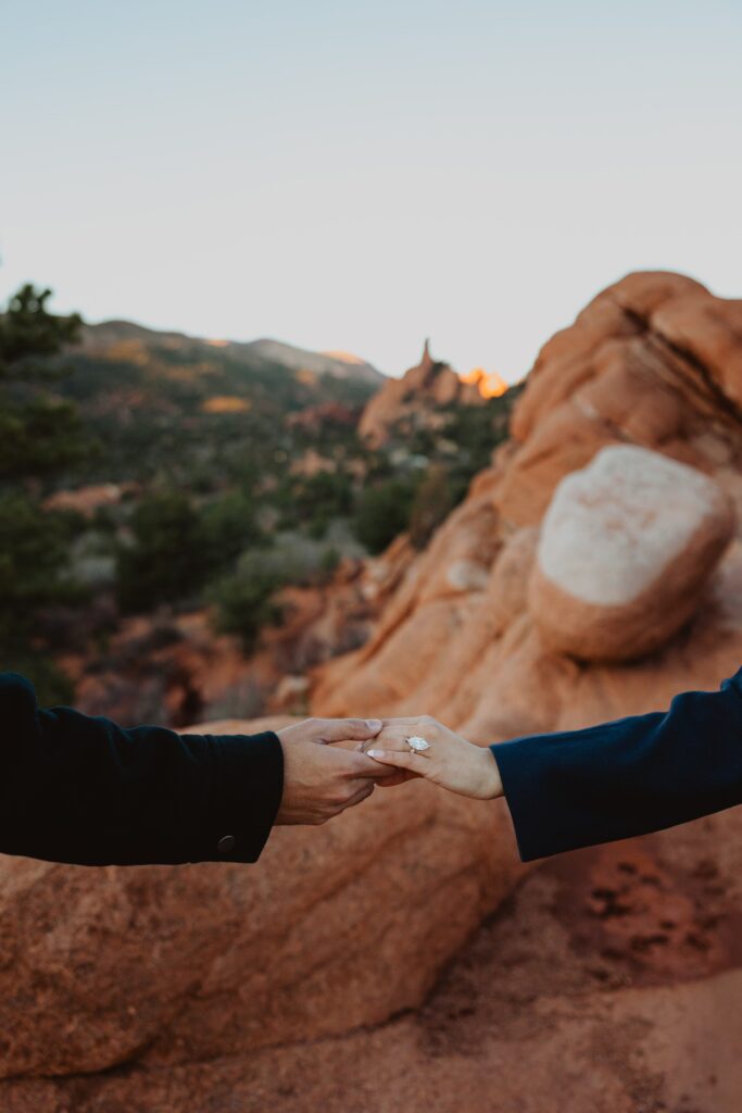 Couple holding hands at Garden of the Gods for Colorado Springs engagement photos
