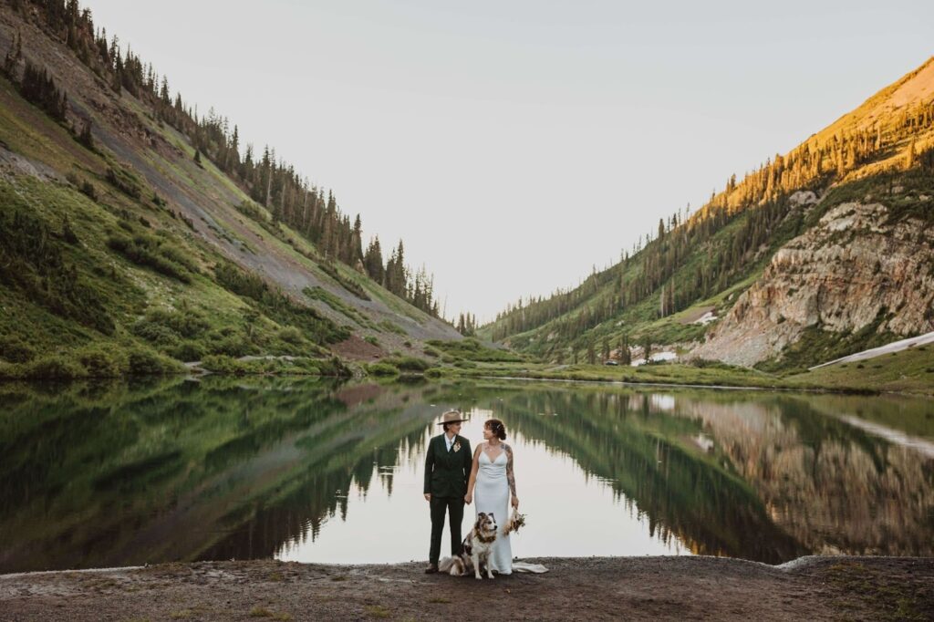 Couple posing with dog for elopement photos