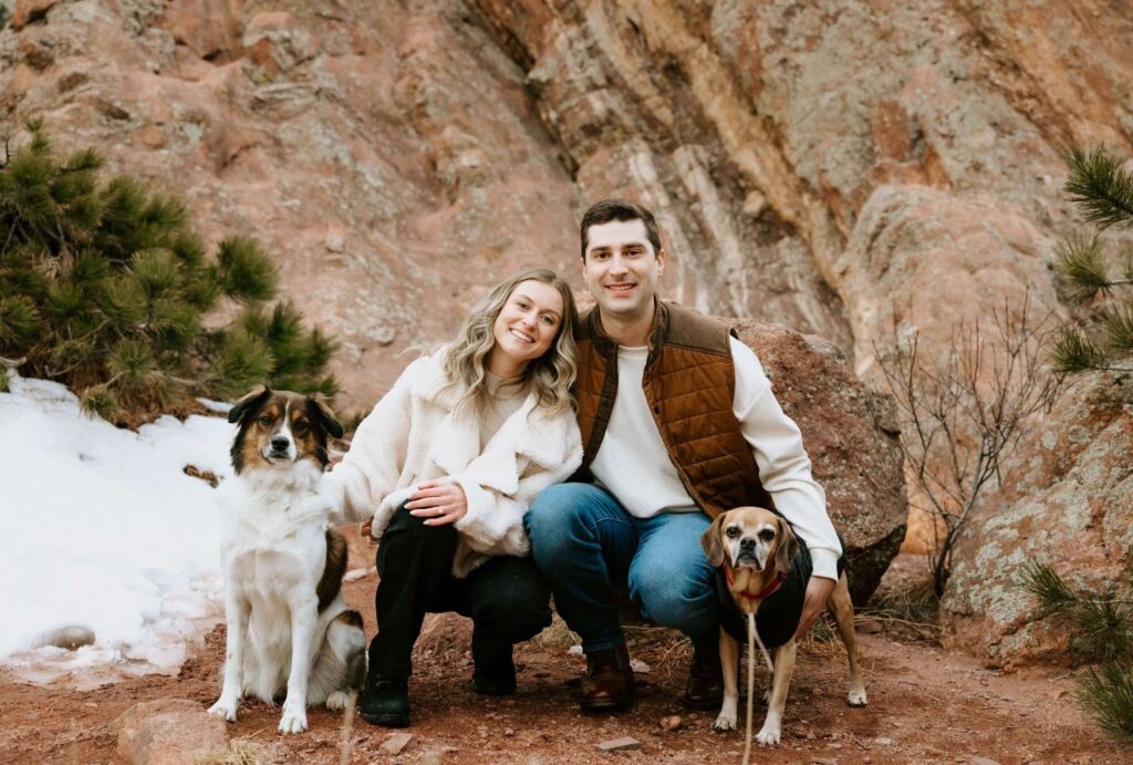 Couple posing with dogs