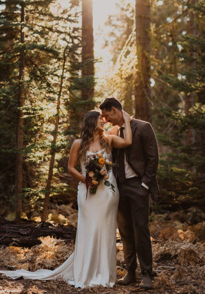 Bride and groom posing for wedding photo at Yosemite National Park