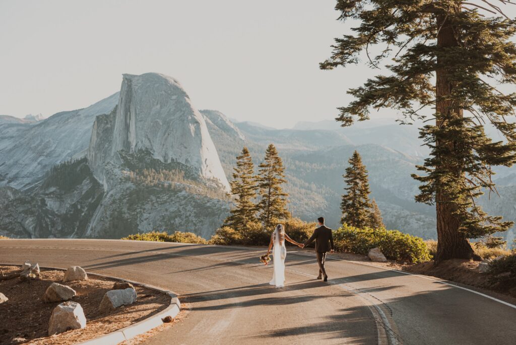 Bride and groom walking at Yosemite National Park