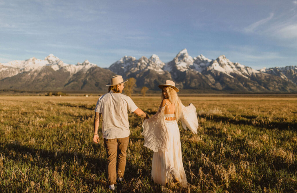 Bride and groom posing for elopement photo at Grand Teton National Park