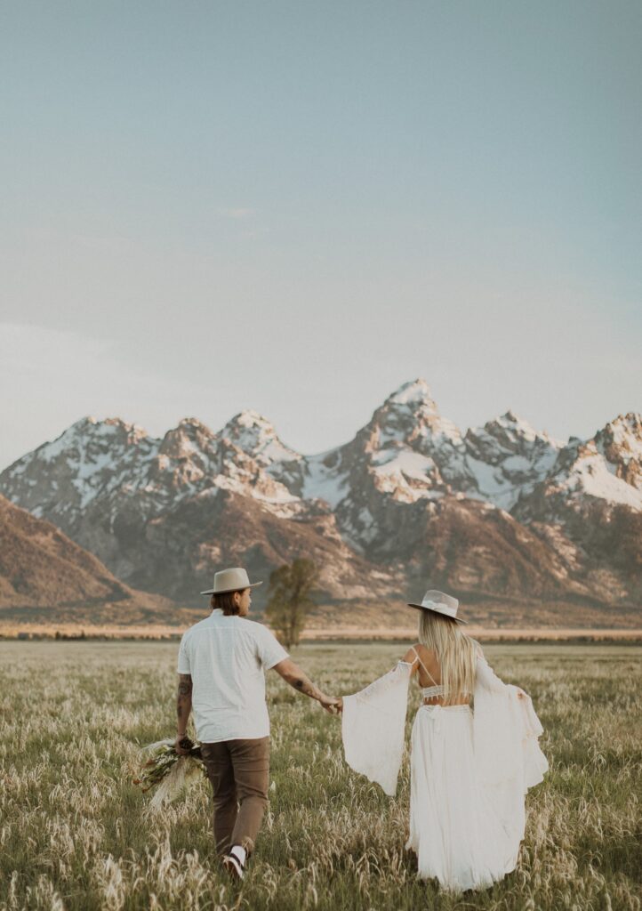 Couple facing mountains for Grand Teton elopement photo
