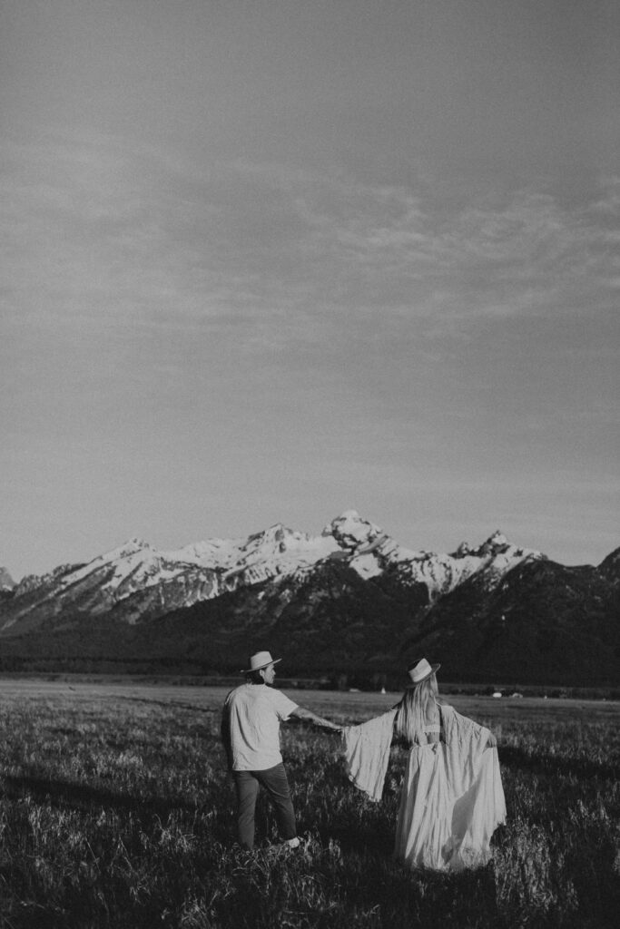Couple holding hands at Grand Teton National Park