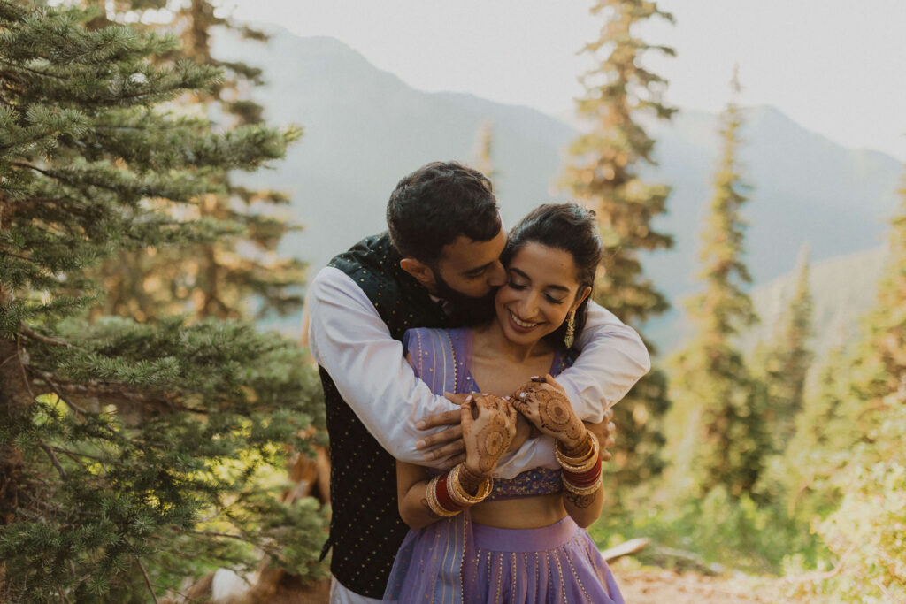 Man hugging woman and kissing her cheek