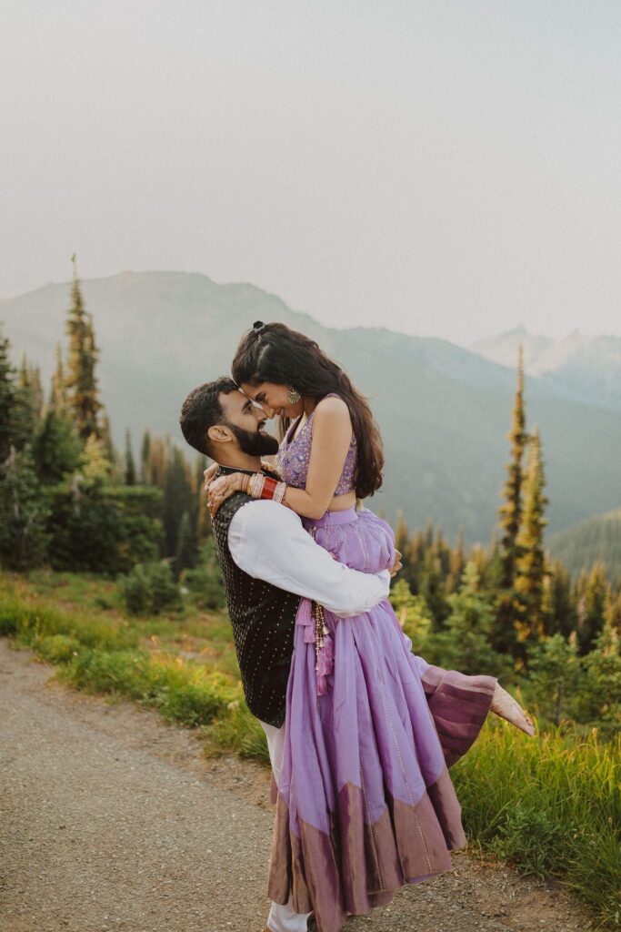 Groom picking up wife