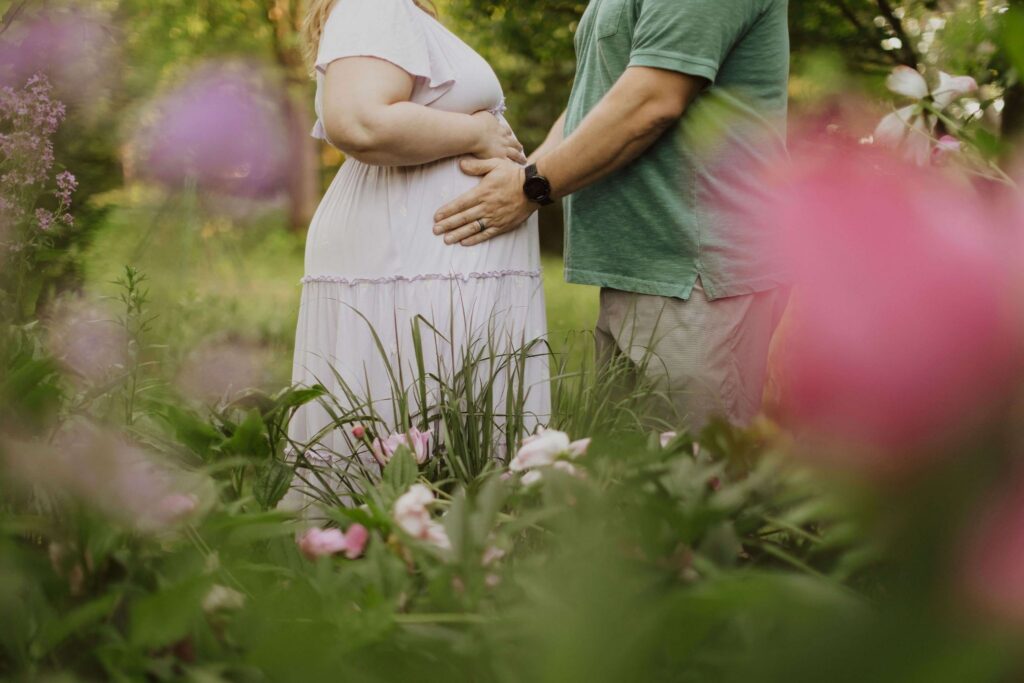pregnant woman and man in garden