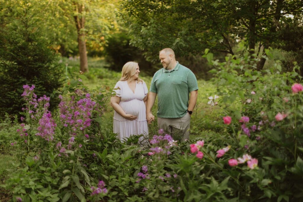 pregnant woman and man in garden