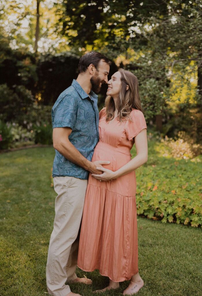 Man and pregnant woman smiling at each other